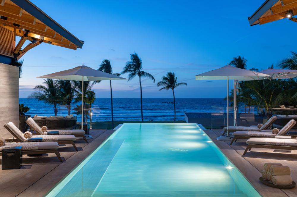 Modern luxury villa Casa Vaivén in Punta Mita showing the panoramic rooftop terrace with sunset views over the Mexican coast.