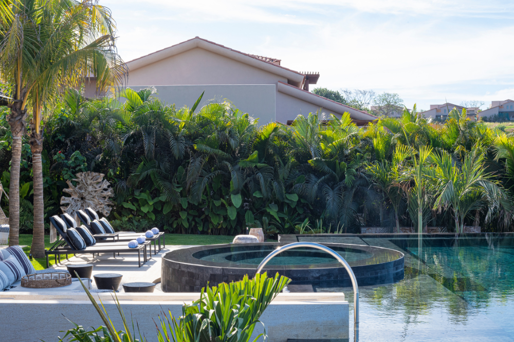 Aerial view of Casa Alum's infinity pool in the jungle, a highest-rated luxury house with ocean views in Kupuri, Punta Mita.