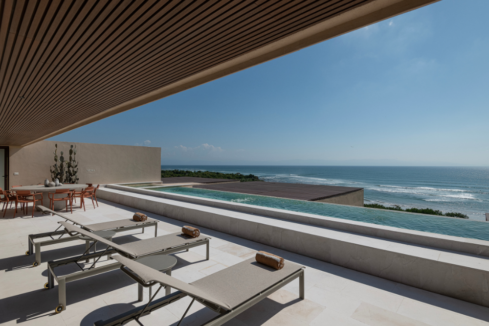 Two-story luxury penthouse at Surf Residences featuring a private rooftop jacuzzi and panoramic Pacific views.
